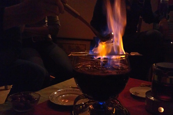 Preparing a Feuerzangenbowle - burning the sugar not the couch table